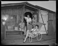 Three women in front of an outbuilding perhaps on the property of Jack Donovan, Santa Monica, circa 1953