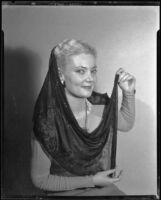 Marie Mulligan in a dress and dark veil, Santa Monica, 1940-1950