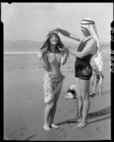 Eugene d'Orange and Valeska Radd wearing keffiyehs on the beach, Santa Monica, 1931