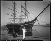 Clara and Carolyn Bartlett with sailing ships docked in the harbor, Long Beach, 1930