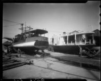 Two boats in the ship yard, Long Beach Harbor, Long Beach, 1930