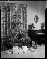 Christmas gifts under the tree, probably Santa Monica, 1940-1945