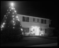 House with outdoor Christmas tree, Santa Monica, 1955