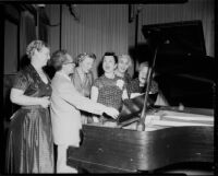 June Moss and conductor Mario Lanza, with members of the Canoga Park Women's Club, Canoga Park, 1955