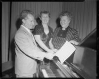 Conductor Mario Lanza with members of the Canoga Park Women's Club, Canoga Park, 1955