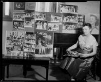 June Moss seated next to layouts of photographs showing her performing in operas, Santa Monica, 1955