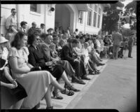 People seated in front of a building at a Santa Monica Civic Music Guild event, Santa Monica, 1948-1952