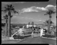 Helen Willard at the entrance drive to the La Paz Guest Ranch, Palm Springs, 1941