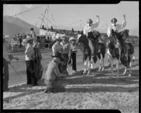 Triumphant horsewomen at a Palm Springs Field Club rodeo event, circa 1941