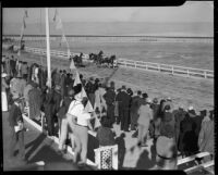Spectators watching a harness race at the Palm Springs Field Club, circa 1941