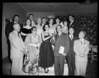 Natalie Garrotto handing a trophy to Enrico Porta, with members of the Santa Monica Civic Opera Association, Santa Monica, 1951