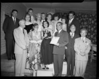 Natalie Garrotto holding a trophy for Enrico Porta, with members of the Santa Monica Civic Opera Association, Santa Monica, 1951