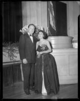Natalie Garrotto and Ray Gagan standing in front of a stage before or after a United Nations event, circa 1950