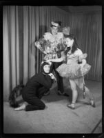 One male and two female ballet students of the Elena Vartova dance school posing in costume, (Santa Monica?), circa 1951