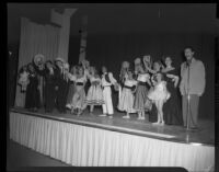 Ensemble of ballet students of the Elena Vartova dance school, ventriloquist Lucille S. King and other adults on stage, (Santa Monica?), circa 1951