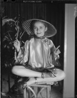 Dance student of the Elena Vartova dance school posing in a Chinese costume, (Santa Monica?), circa 1951