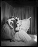 Three students of the Elena Vartova dance school posing in costume, (Santa Monica?), circa 1951