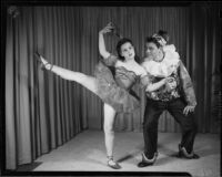 Pair of male and female ballet students of the Elena Vartova dance school posing in costume, (Santa Monica?), circa 1951