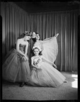 Three students of the Elena Vartova dance school posing in costume, (Santa Monica?), circa 1951