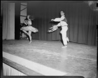 Pair of male and female ballet students of the Elena Vartova dance school performing on stage, (Santa Monica?), circa 1951