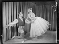 Pair of male and female ballet students of the Elena Vartova dance school posing in costume, (Santa Monica?), circa 1951