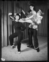 One male and two female ballet students of the Elena Vartova dance school posing in costume, (Santa Monica?), circa 1951