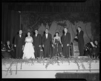 Ray Gagan, June Moss, Enrico Porta, Natalie Garrotto, and Ernest Mireles with orchestra onstage, perhaps for a United Nations event, circa 1950