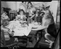 Rin Tin Tin Jr. having lunch with children at the Salvation Army, Santa Monica, circa 1932-1938