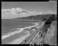 View toward lighthouse building from Palisades cliffs above Will Rogers Beach, Los Angeles, 1930s
