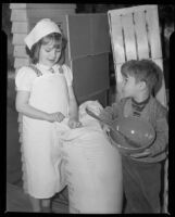 Girl and boy helping with kitchen work at the Children's Home Society, Los Angeles, 1935-1960