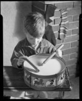 Boy playing a toy drum at the Children's Home Society, Los Angeles, 1935-1960