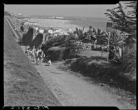 Beach goers walking up the Idaho path from the California Incline to Palisades Park, Santa Monica, 1938-1950