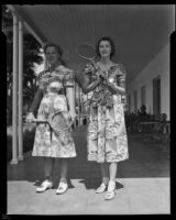 Lee sisters holding tennis racquets, 1938
