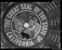 Great Seal of the State of California painted on a tree trunk at the Golden Gate International Exposition, San Francisco, 1939