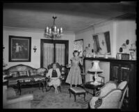 Two women in the living room of the home of Mary Long, an Alaska pioneer, Huntington Park, 1955