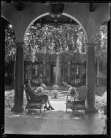 Woman seated in the patio of El Mirasol Hotel, Santa Barbara, 1941