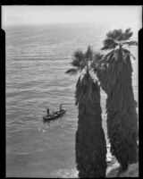 Men spear fishing from a canoe off the Santa Barbara coast, Santa Barbara, 1939