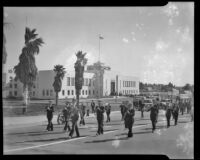Military band marching past City Hall during an Army draft ceremony, Santa Monica, 1940
