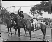 Actresses Evelyn Venable, Ann Rutherford, and Linda Ware on horseback at the Will Rogers Memorial Celebration parade, Santa Monica, 1940