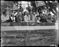 Mayor Claude C. Crawford, Chief Webb and others in the reviewing stand at the Will Rogers Memorial Celebration parade, Santa Monica, 1940