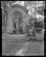 Bust sculpture of Pan on the grounds of the Science and Education Building in Balboa Park, San Diego, circa 1935