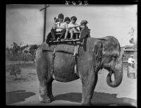 Children on elephant ride in Balboa Park, San Diego