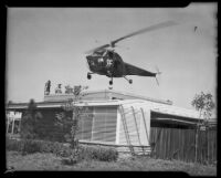 Helicopter taking off from a house top, Los Angeles, 1940