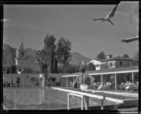 Man diving into El Mirador hotel pool, Palm Springs, 1941