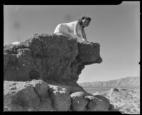 Betty Shafer on a desert rock formation, Palm Springs vicinity, 1942