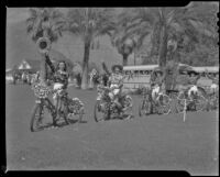 Girls in western outfits on bicycles on the day of the Desert Circus Parade, Palm Springs, 1941