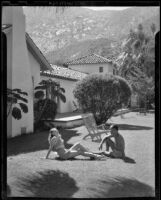 Couple sunbathing in Desert Inn, Palm Springs, 1945