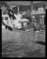 Woman preparing to dive into Desert Inn pool, Palm Springs, 1945