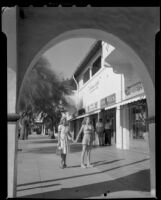 Women posing at shopping center, Palm Springs, 1945