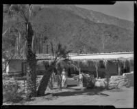 Man standing in front of a house, Palm Springs, 1935